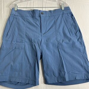 Bermuda shorts. Quick drying fabric. Button and snap closure. Zippered pockets.
